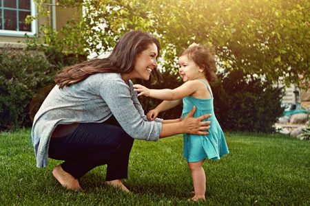 mom and daughter playing outside
